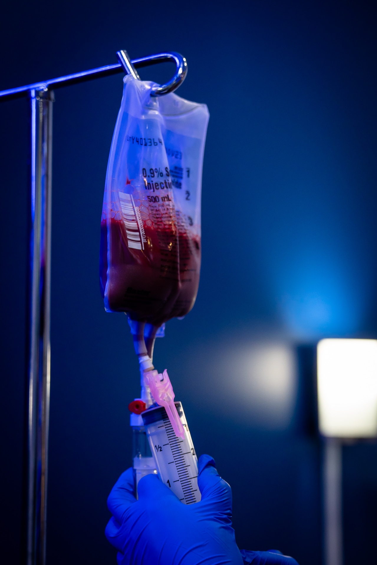 Licensed RN preparing an Ozone UV IV infusion at iCRYO One Loudoun